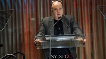 Andreas Dracopoulos, President of the Stavros Niarchos Foundation speaks at the podium